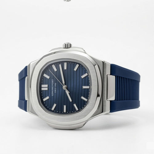 Watch with blue strap and blue dial on a white background