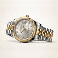 Luxury watch with silver and gold band on a light beige background