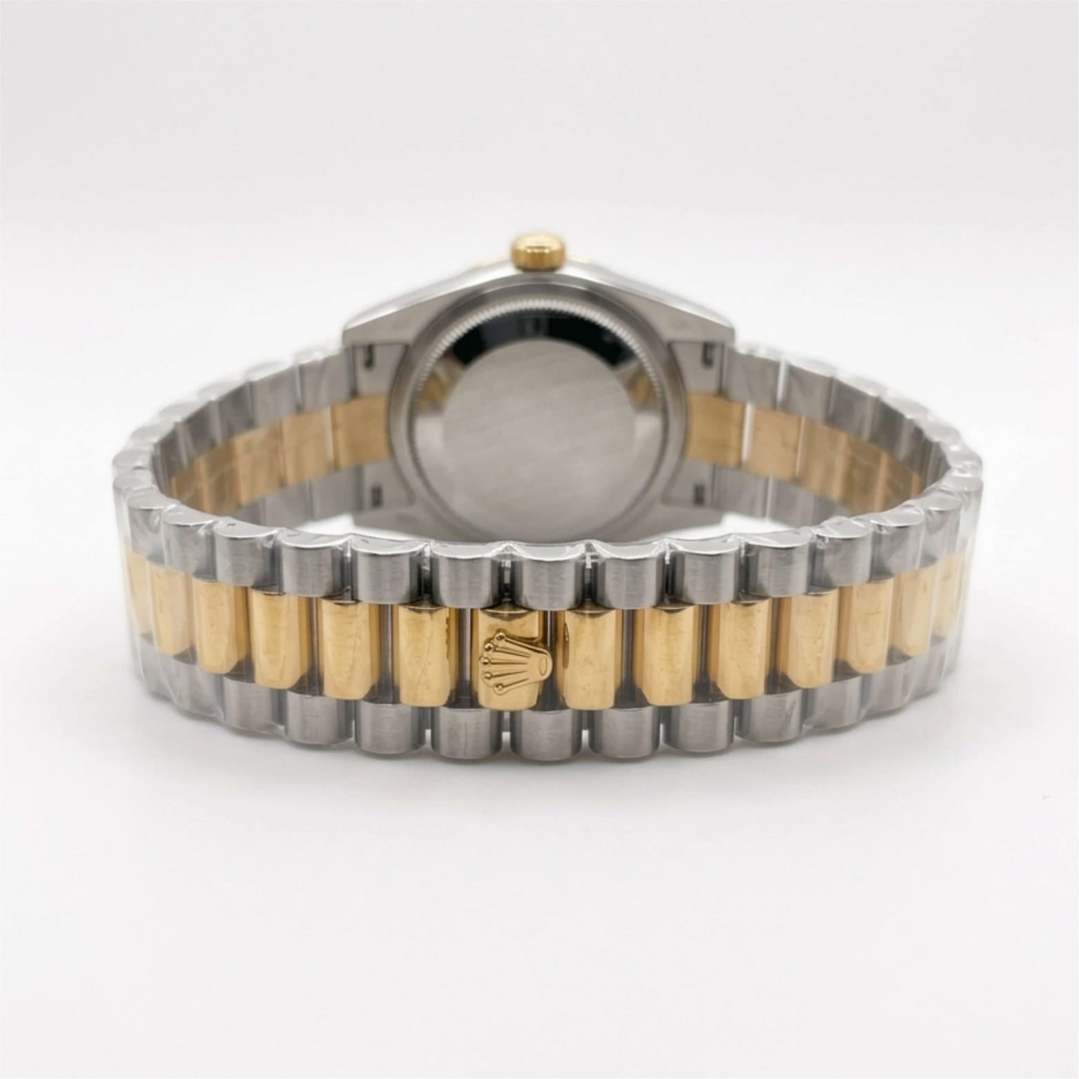 Two-tone watch with silver and gold band on a white background