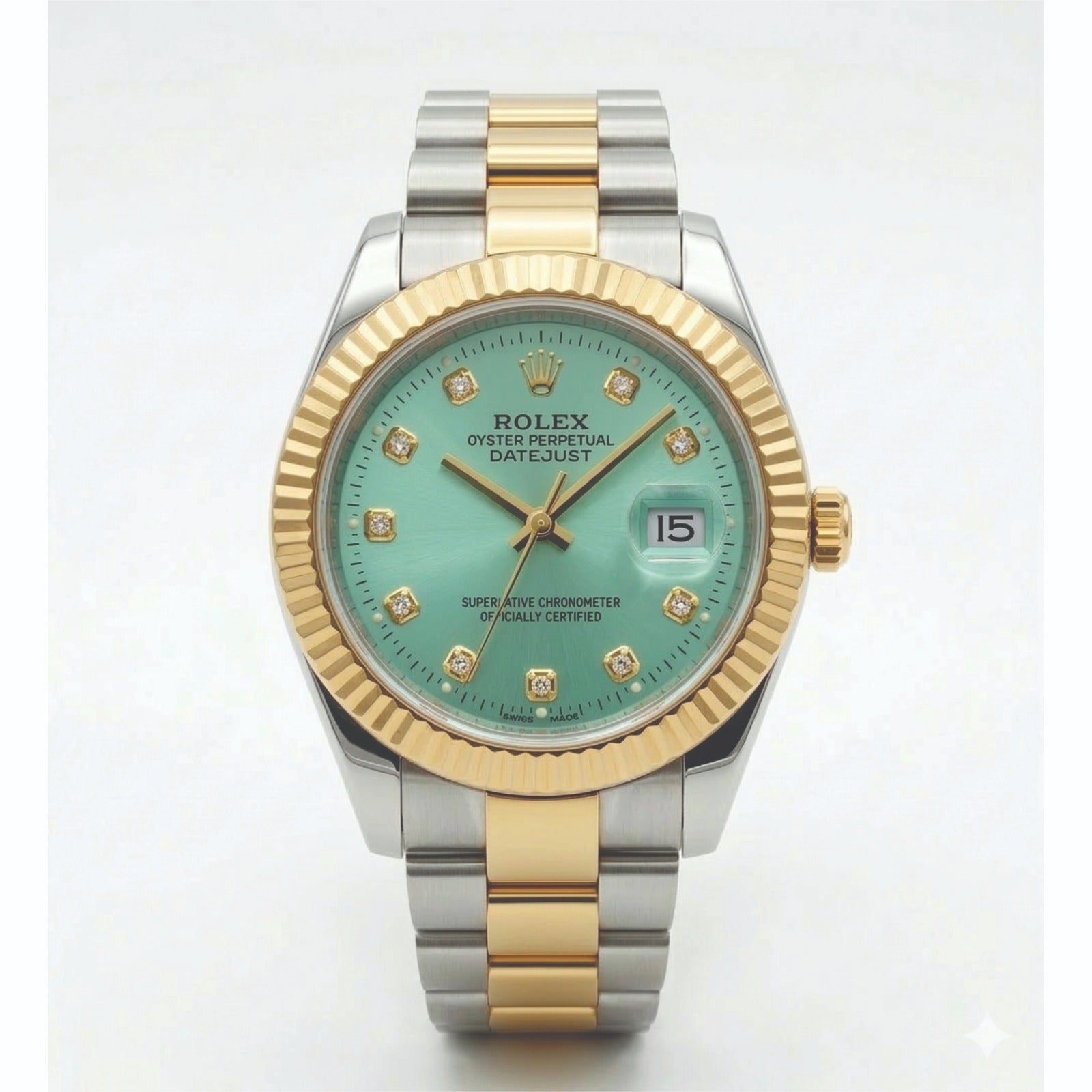 Luxury watch with green face and gold and silver band on white background