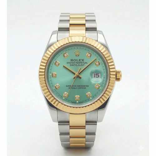 Luxury watch with green face and gold and silver band on white background