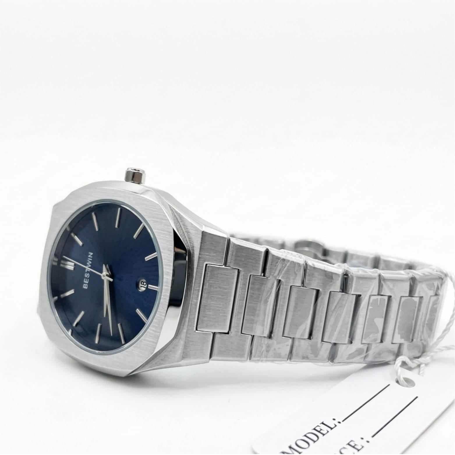 Silver watch with blue face on a white background